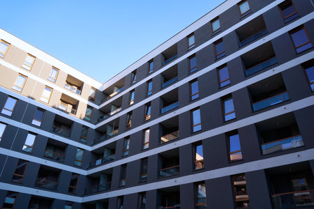Warsaw, Poland, June 5th 2022 - Modern residential building with balconies. Real estate market and housing issues concept.のeditorial素材