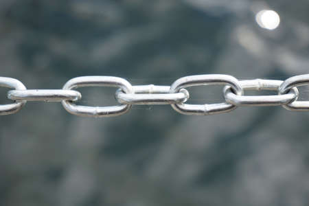 Silver metal chain, defocused backgroundの写真素材