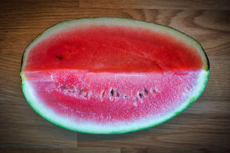 Cut watermelon on wooden table