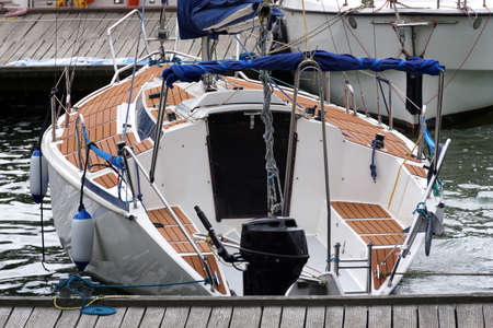 Sailboat moored in port - rear view
