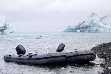 Jokulsarlon - glacial lagoon in Iceland, rigid inflatable boat on first plan
