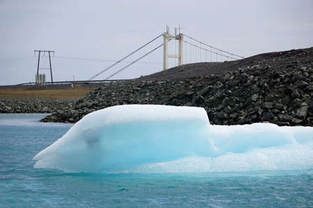Jokulsarlon - glacial lagoon in Iceland, bridge on second plan