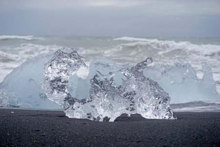 Block of ice on a black, volcanic shore - Diamond Beach in Iceland