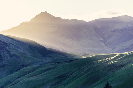 Sunset through mountains with sunrays, Iceland - HDR photograph