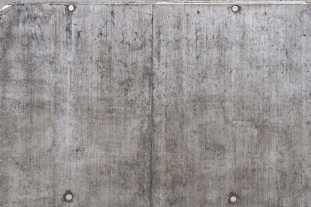 Weathered concrete wall with technological wholes - dot patternの写真素材