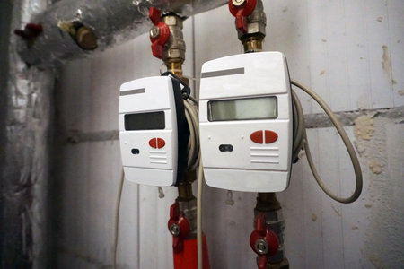 Two central heating meters installed on water pipes