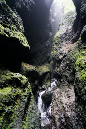 Creek in Raudfeldsgja Cave on Snaefellsnes Peninsula in Icelandの写真素材