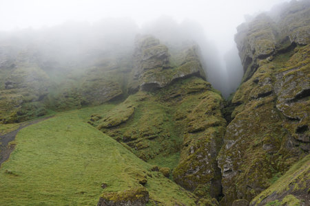 Rocks and fog at Raudfeldsgja Gorge on Snaefellsnes Peninsula in Icelandの写真素材