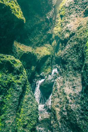 Creek in Raudfeldsgja Cave on Snaefellsnes Peninsula in Icelandの写真素材