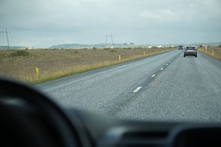 Driving a car - perspective of a driverの写真素材