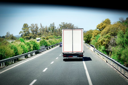 Truck on a highway - back viewの写真素材