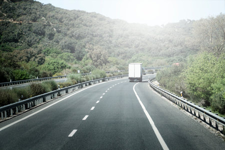 Truck on a highway - back viewの写真素材