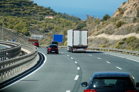 Truck on a highway - back viewの写真素材