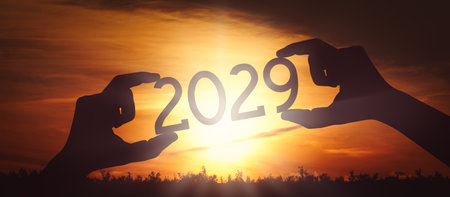 2029 - human hands holding black silhouette year numberの写真素材