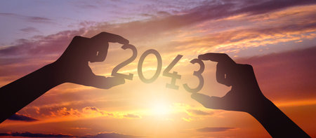 2043 - human hands holding black silhouette year numberの写真素材