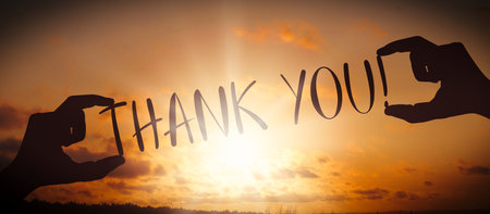 Thank you - human hands holding black silhouette wordsの写真素材