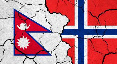 Flags of Nepal and Norway on cracked surface - politics, relationship conceptの写真素材