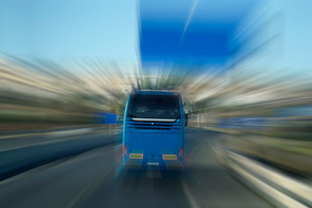 Tourist bus on a highway, motion blur effect - back viewの写真素材