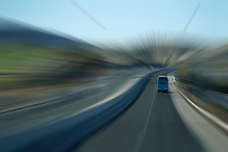 Tourist bus on a highway, motion blur effectの写真素材