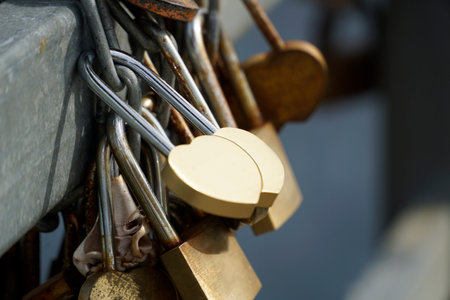 Many padlocks closed on bridge fence - love conceptの写真素材