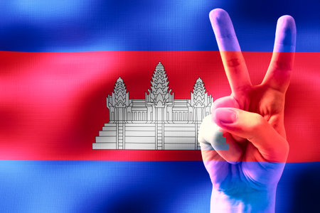 Cambodia - two fingers showing peace sign and national flagの写真素材