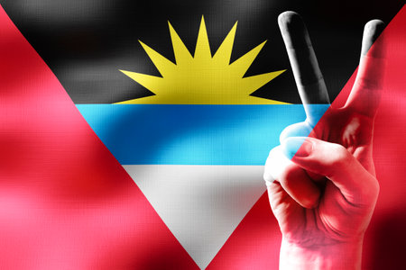 Antigua and Barbuda - two fingers showing peace sign and national flagの写真素材