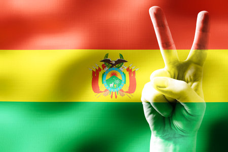 Bolivia - two fingers showing peace sign and national flagの写真素材