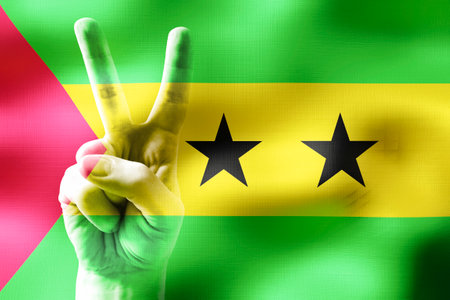 Sao Tome and Principe - two fingers showing peace sign and national flagの写真素材