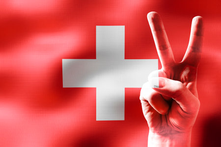 Switzerland - two fingers showing peace sign and national flagの写真素材