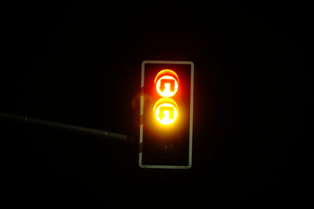 Red and orange traffic light at night