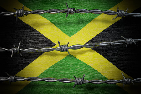 Jamaica flag and barbed wire - 3d illustrationの写真素材