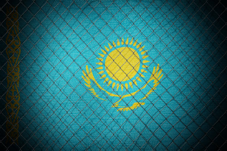 Kazakhstan flag and wire mesh fence - 3d illustrationの写真素材