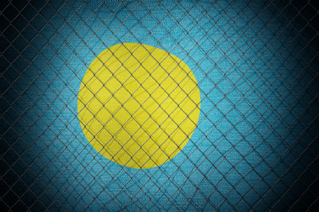 Palau flag and wire mesh fence - 3d illustrationの写真素材
