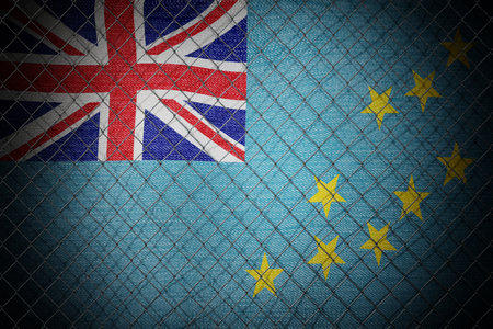 Tuvalu flag and wire mesh fence - 3d illustrationの写真素材