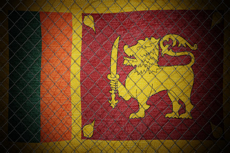 Sri Lanka flag and wire mesh fence - 3d illustrationの写真素材