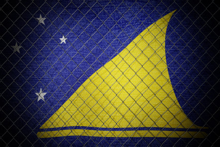 Tokelau flag and wire mesh fence - 3d illustrationの写真素材
