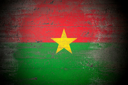 Flag of Burkina Faso on rough concrete wallの写真素材
