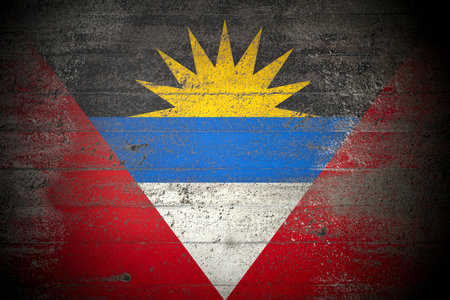 Flag of Antigua and Barbuda on rough concrete wallの写真素材