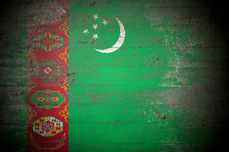 Flag of Turkmenistan on rough concrete wallの写真素材