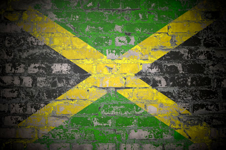 Flag of Jamaica on brick wallの写真素材