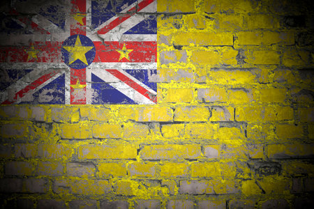 Flag of Niue on brick wallの写真素材