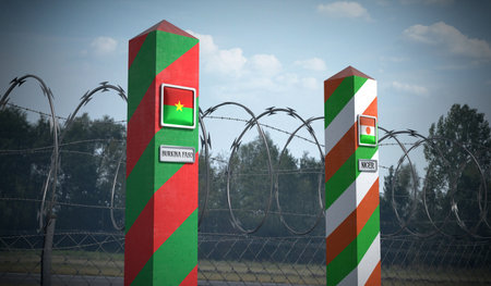 Border posts with flags of Burkina Faso and Niger - 3d illustrationの写真素材