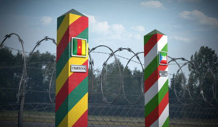 Border posts with flags of Cameroon and Equatorial Guinea - 3d illustrationの写真素材