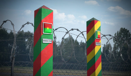 Border posts with flags of Burkina Faso and Benin - 3d illustrationの写真素材