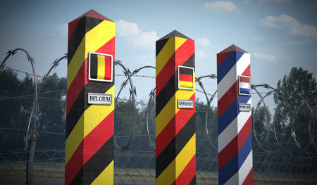 Border posts with flags of Belgium, Germany and Netherlands - 3d illustrationの写真素材