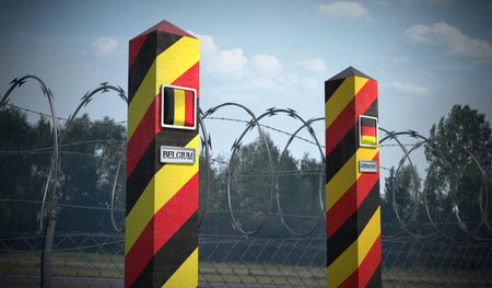 Border posts with flags of Belgium and Germany - 3d illustrationの写真素材