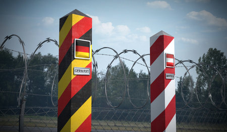 Border posts with flags of Germany and Austria - 3d illustrationの写真素材