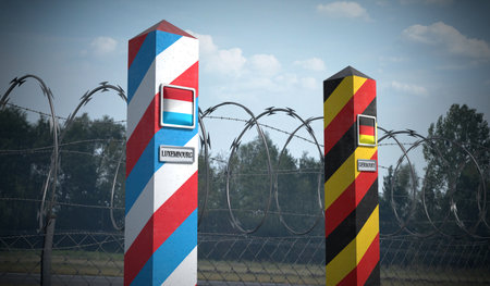 Border posts with flags of Luxembourg and Germany - 3d illustration