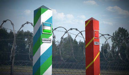 Border posts with flags of Uzbekistan and China - 3d illustration