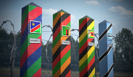 Border posts with flags of Namibia, Zambia, Zimbabwe and Botswana - 3d illustrationの写真素材